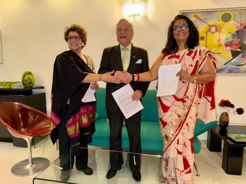 Officials exchanging documents and handshake during the PSAI–APAR and CanKids MOU signing in Gurgaon.