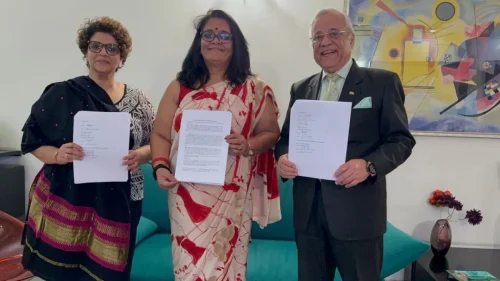Representatives displaying signed MOU documents following the agreement between PSAI, APAR, and CanKids.